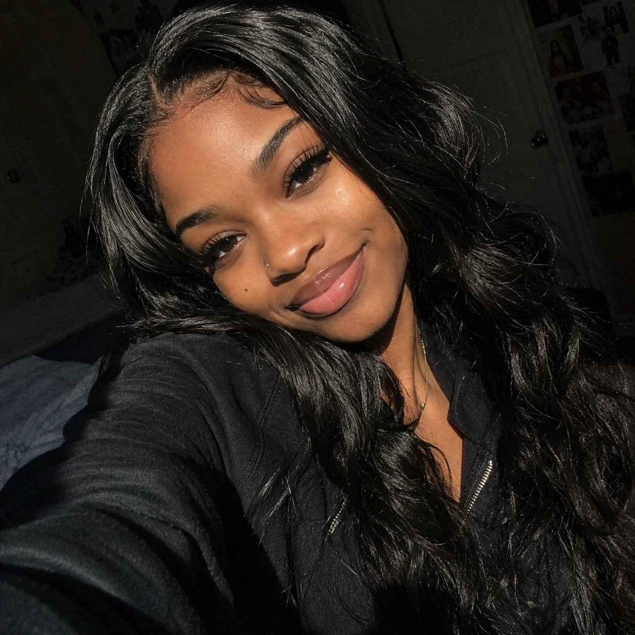 Cute selfie-style black pfp lit by soft window light on the subject.