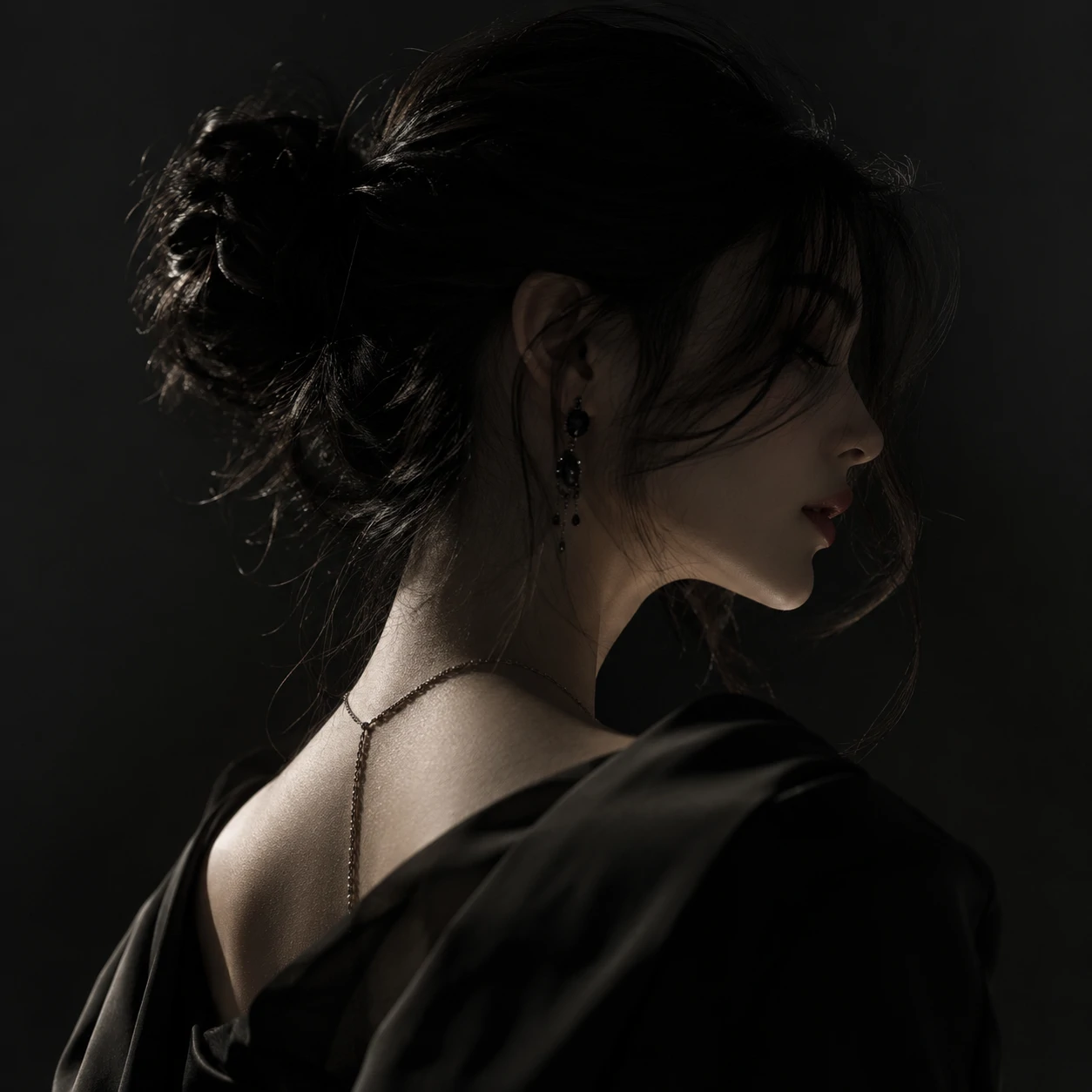 Elegant side-angle black aesthetic pfp girl in soft fall-off lighting.