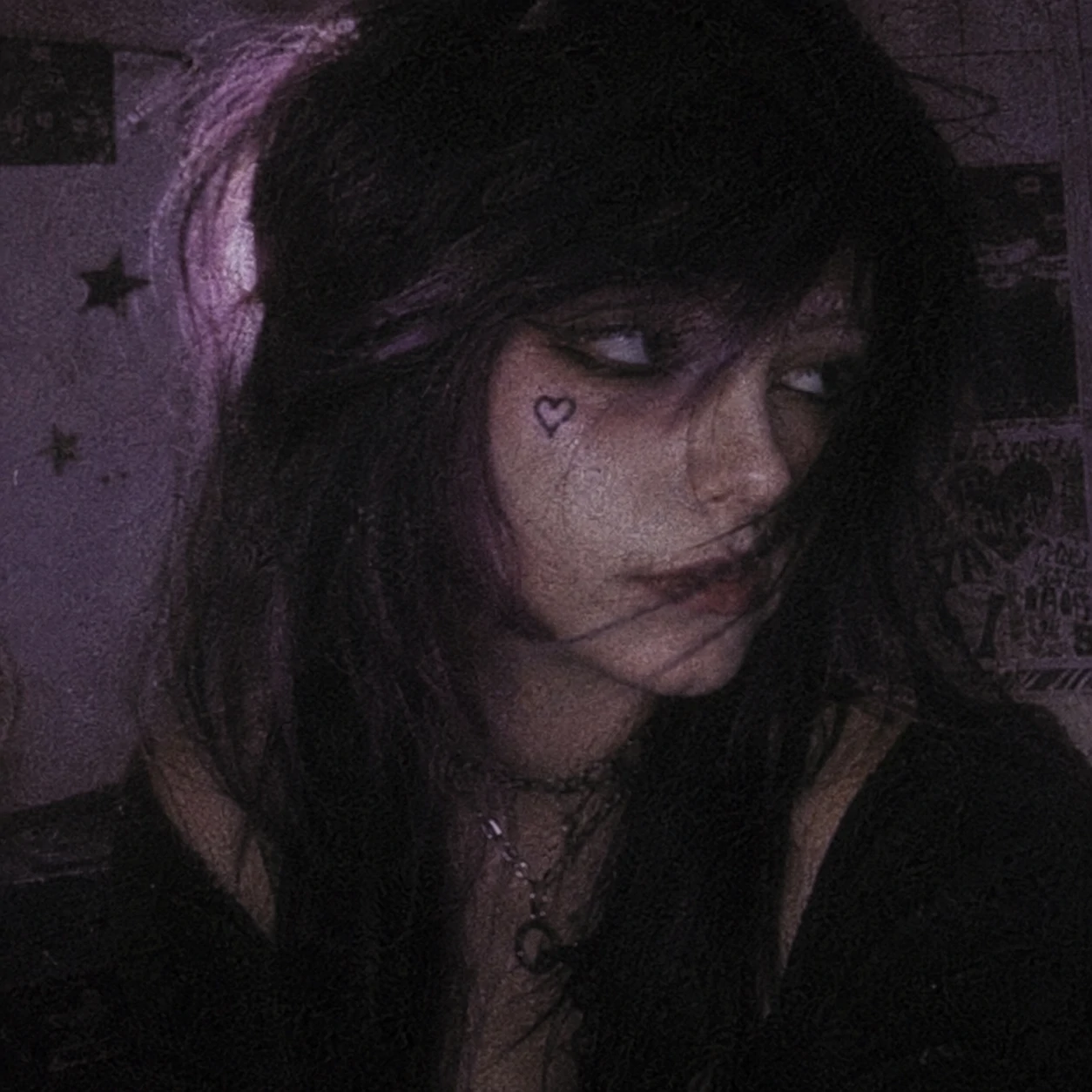 Grainy film-style emo aesthetic PFP with muted purple tones and side-swept fringe