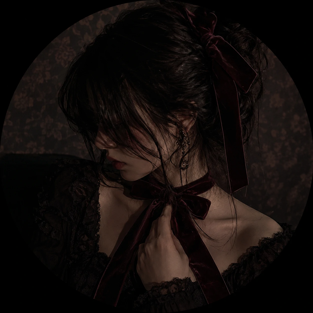 Moody coquette PFP with a velvet ribbon and shadowed background.