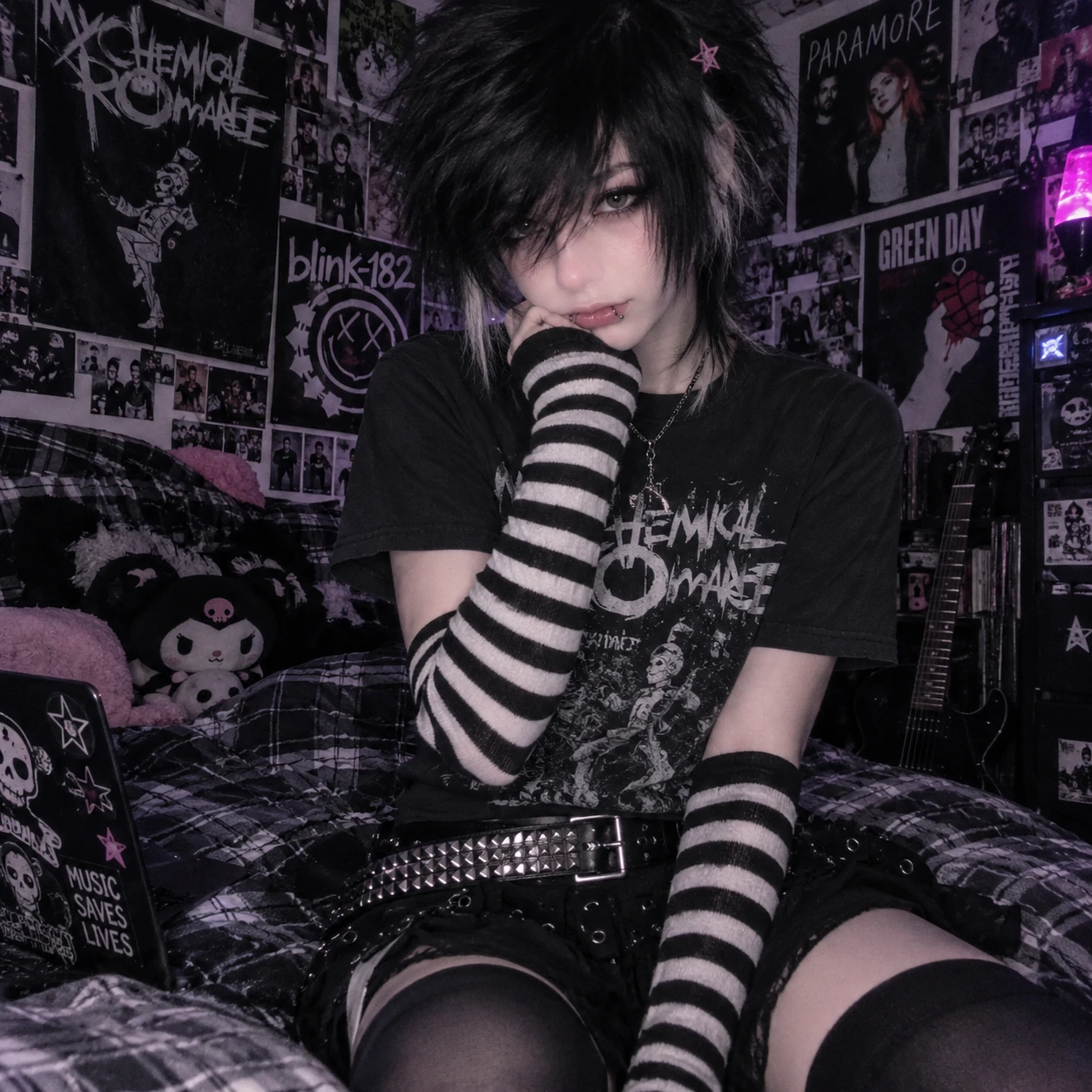 Emo femboy PFP wearing a band tee, striped arm warmers and studded belt
