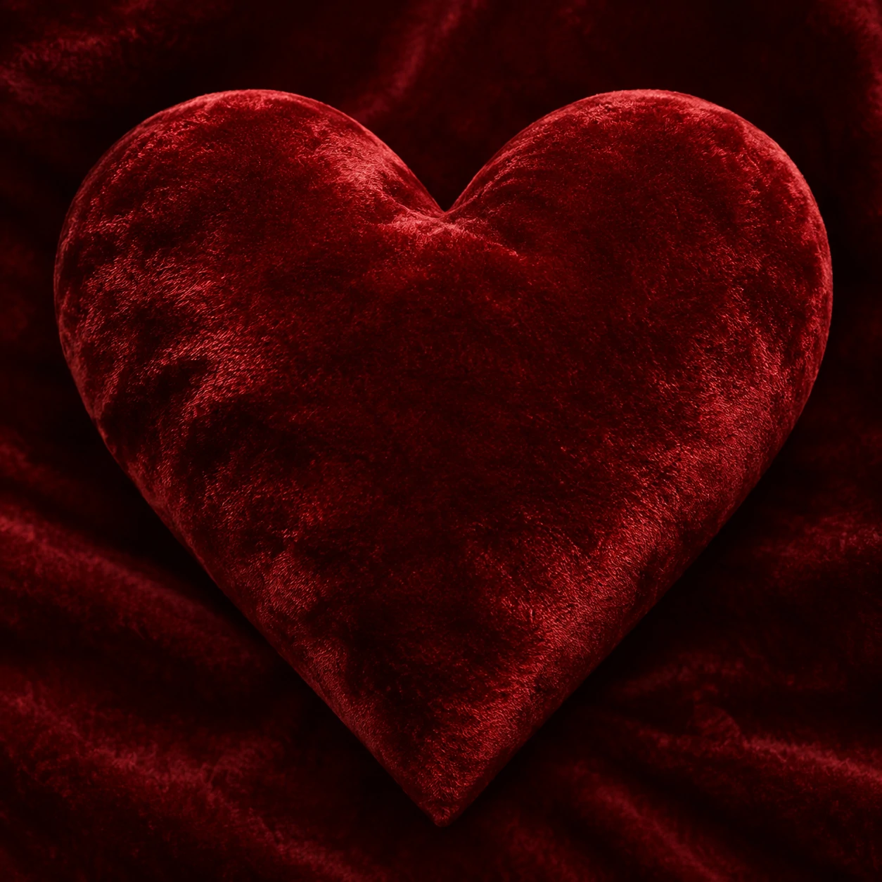 Red heart pfp with soft velvet fabric texture and deep rich crimson tones